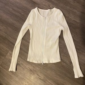 white zip up work out top